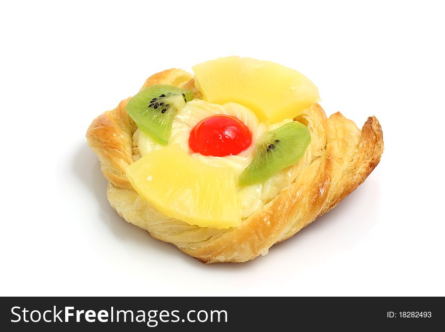 Freshly baked cherry kiwi and pineapple danish pastries fruit tart isolated on white background with copy space. Macro with shallow dof. Freshly baked cherry kiwi and pineapple danish pastries fruit tart isolated on white background with copy space. Macro with shallow dof.