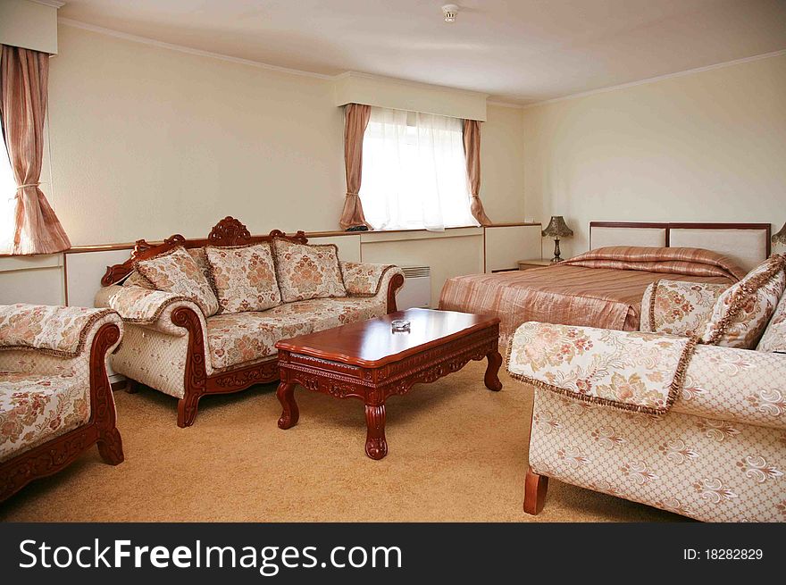 Hotel suite living room with beautiful interior design. Sofa