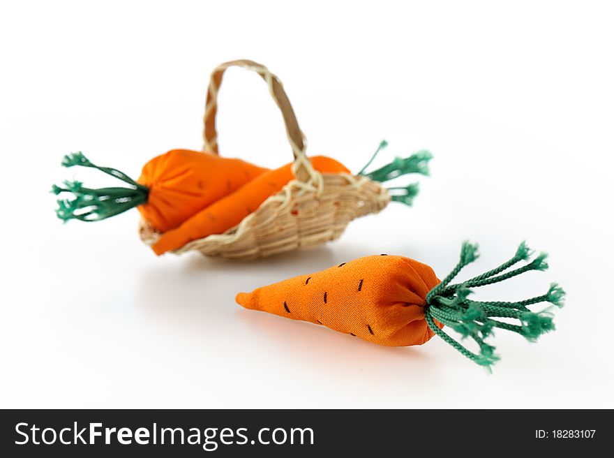 Toy carrot from fabric on white background. Toy carrot from fabric on white background