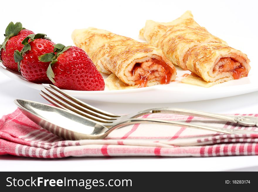 Pancakes with cream and strawberry