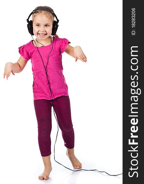 Beautiful girl in headphones dancing to the music