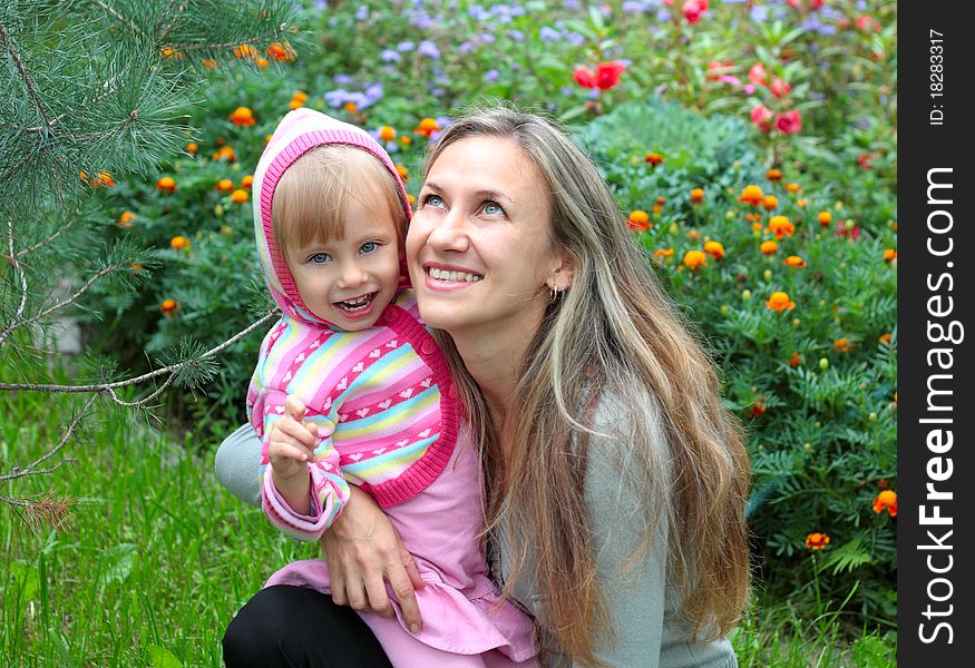 Happy Mom and daughter in the garden