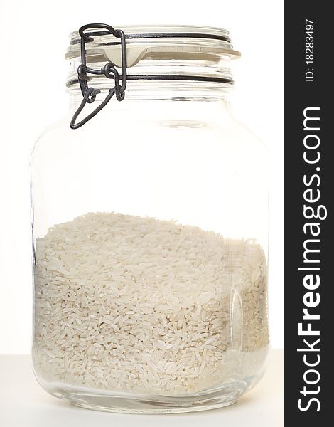 Rice in jar on white background