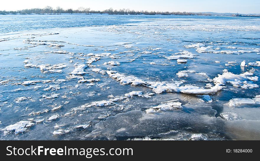 big chunk of ice on frozen river