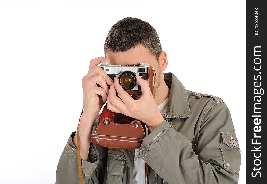 Young professional photographer with old retro film camera. isolated on white background
