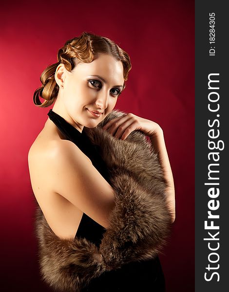 Shot of elegant woman in classic style with fur. Shot of elegant woman in classic style with fur
