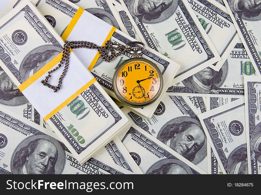 Pocket Watch On A Stack Of Dollars