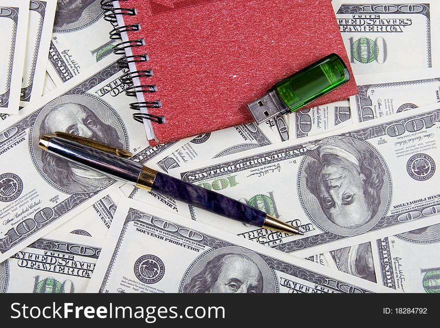 Dollars, notebook and pen, money background