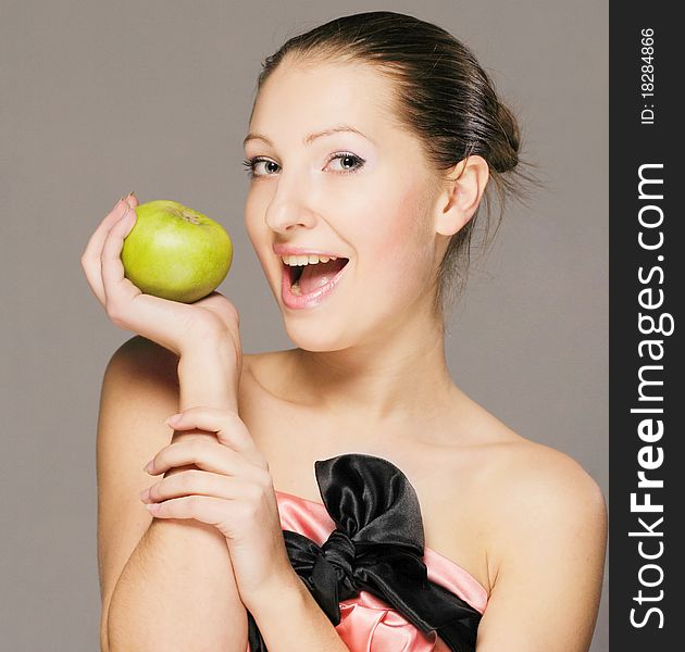 Portrait of a young girl with apple