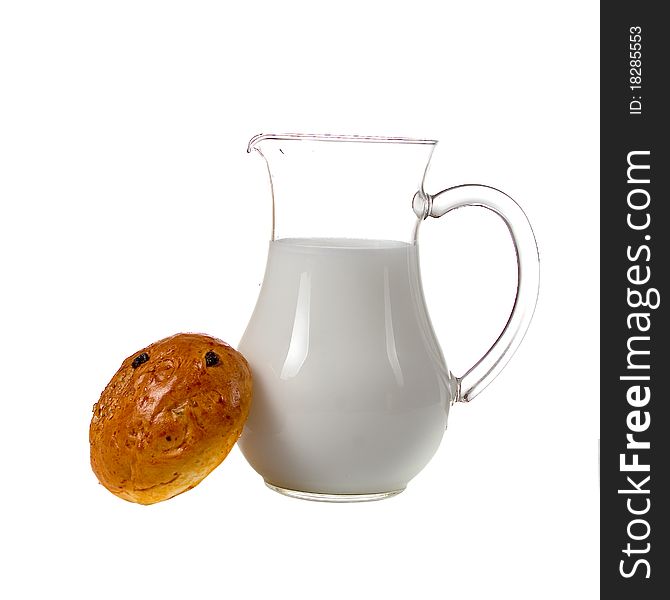 Fresh bread with glass of milk on a white background