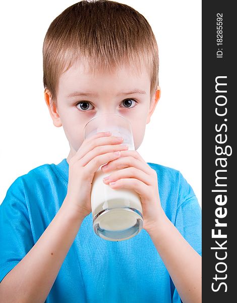 Boy drinks milk isolated on white background. Boy drinks milk isolated on white background