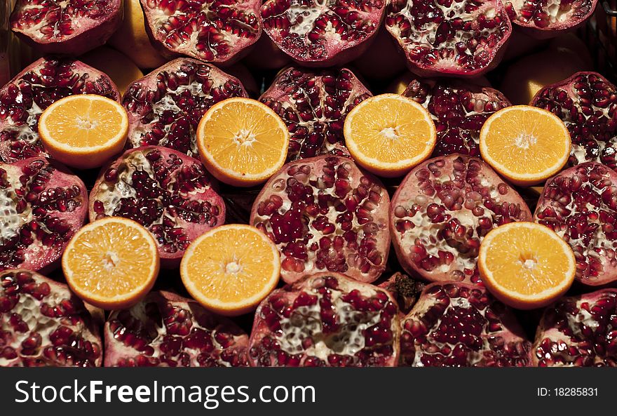 Photo of some pomegranates and oranges. Photo of some pomegranates and oranges.