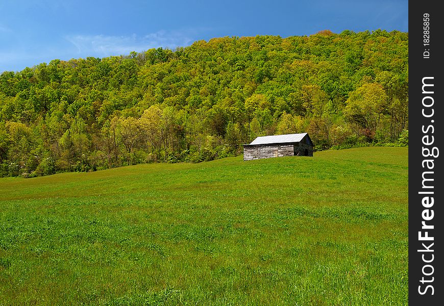 Mountain barn in spring