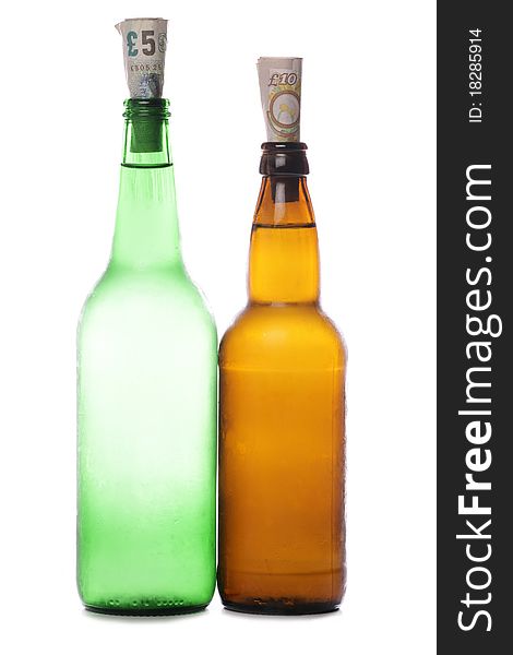 Beer and cider bottles with sterling money