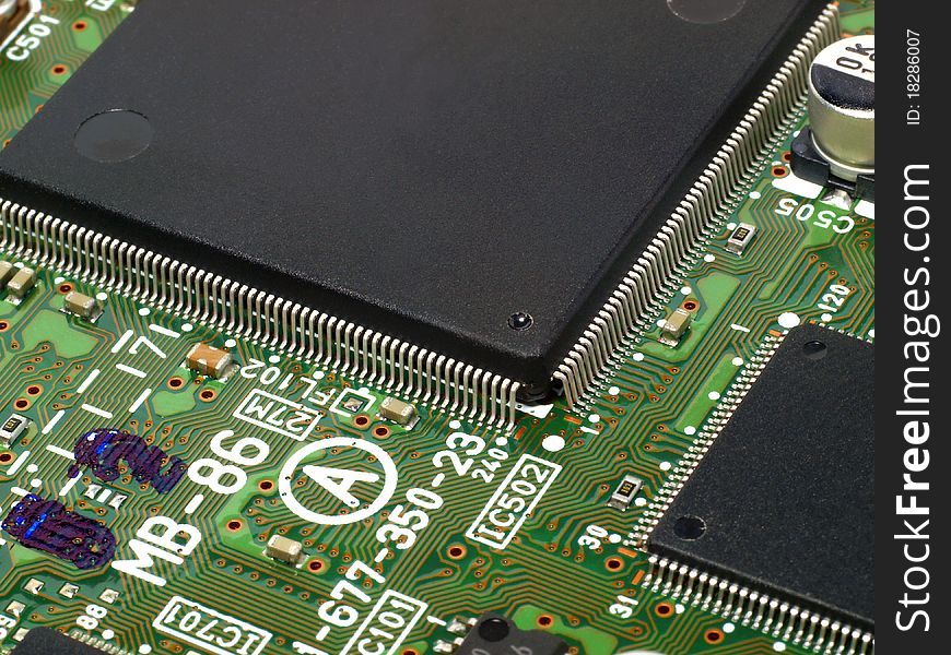 Detailed image of computer motherboard and integrated circuits. Detailed image of computer motherboard and integrated circuits.