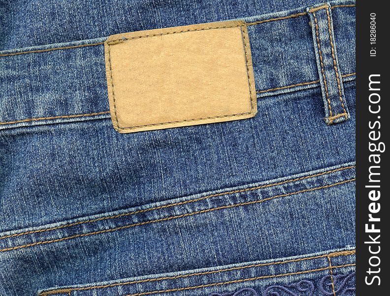 Blank leather label on blue jeans. Blank leather label on blue jeans