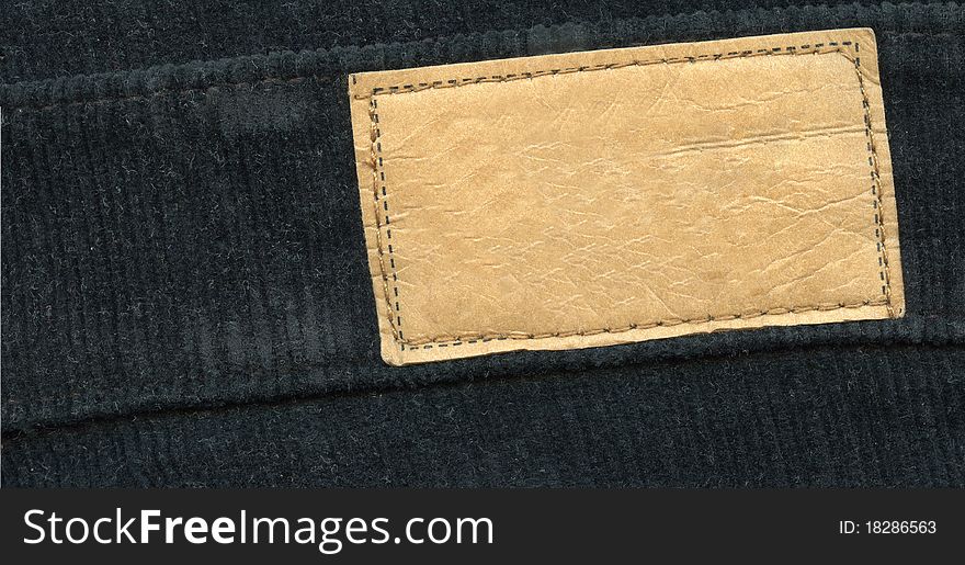 Blank leather label on black jeans. Blank leather label on black jeans