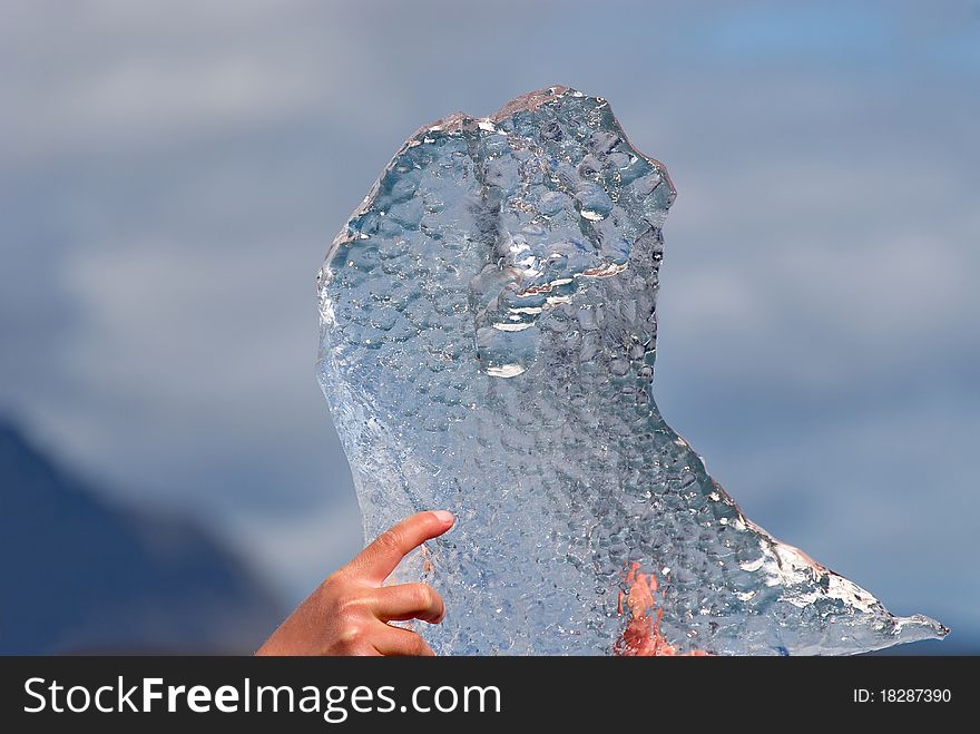 Iceland, a piece of ice of the lake Jokulsarlon held in the hands