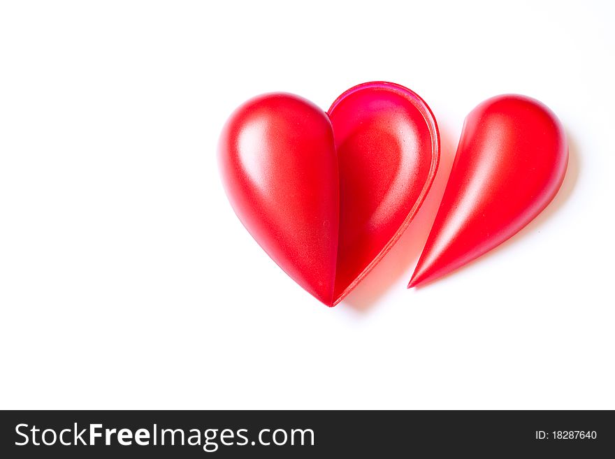 Single red hearts on white background