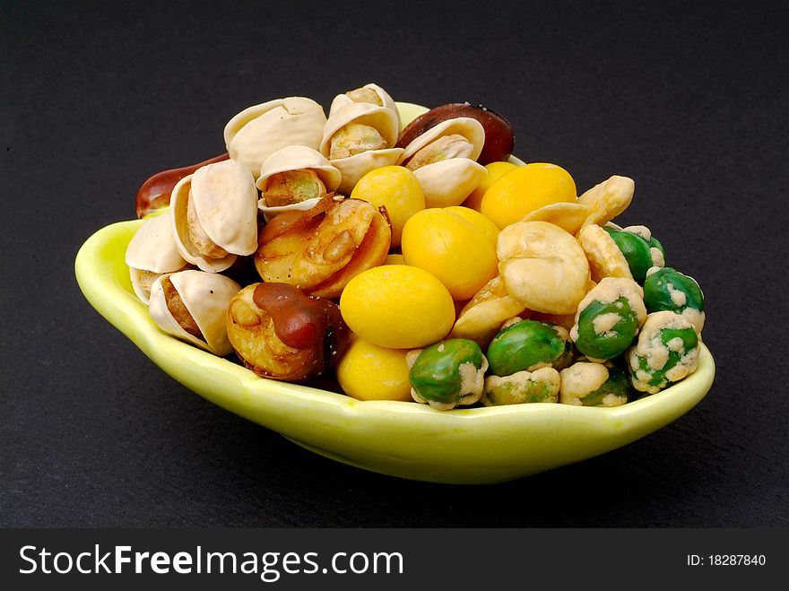 Assortment of asian nuts on jug
