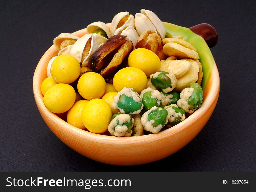 Assortment of asian nuts on jug