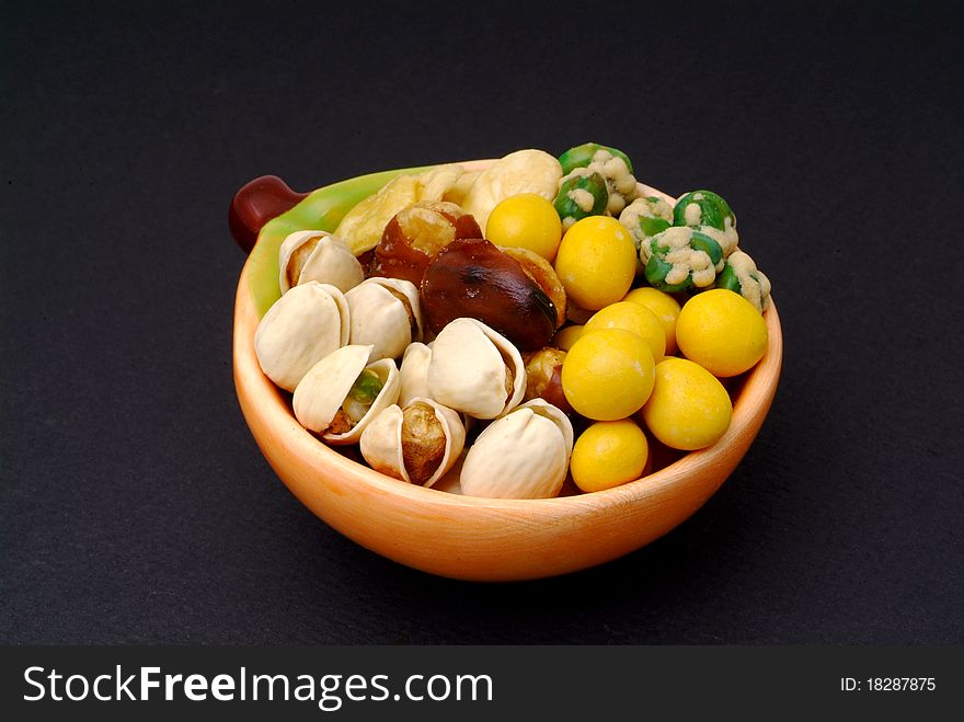 Assortment of asian nuts on jug