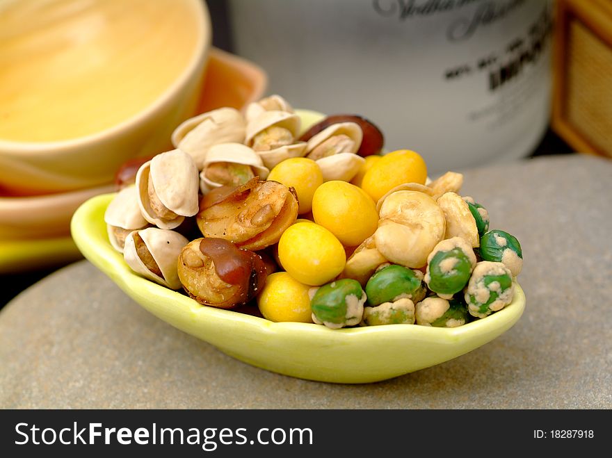 Assortment of asian nuts on jug