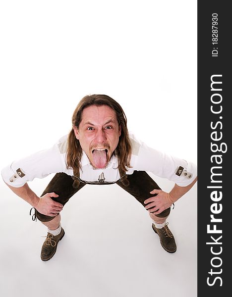 Crazy bavarian man in traditional costume over white background.