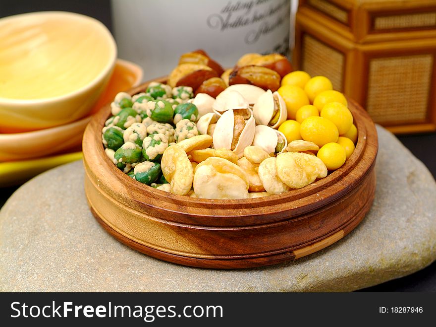 Assortment of asian nuts on jug