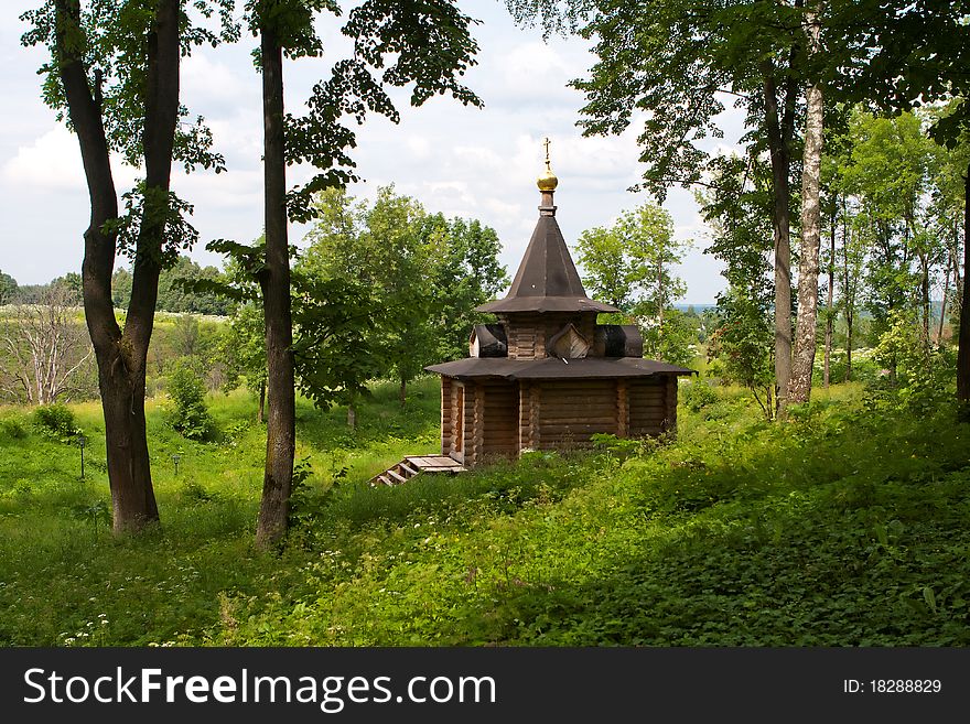 The wooden orthodox church in the forest