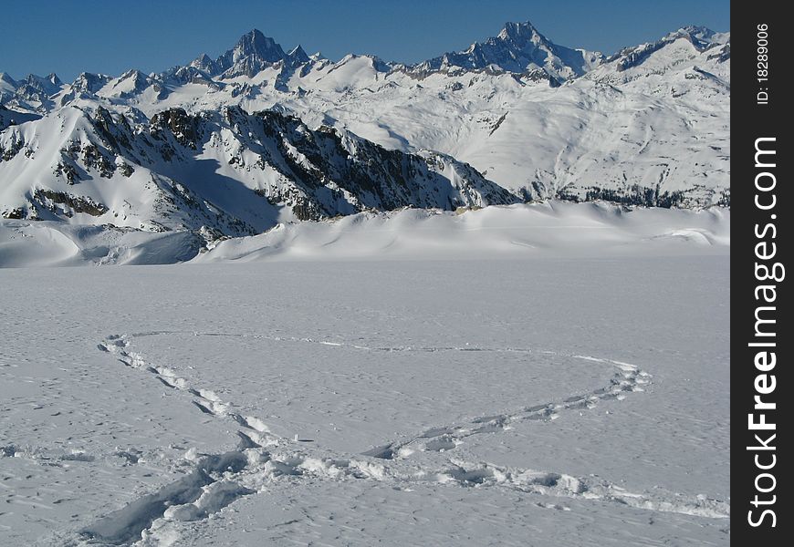 Snow heart on the glacier in the alps on Valentine's day. Snow heart on the glacier in the alps on Valentine's day