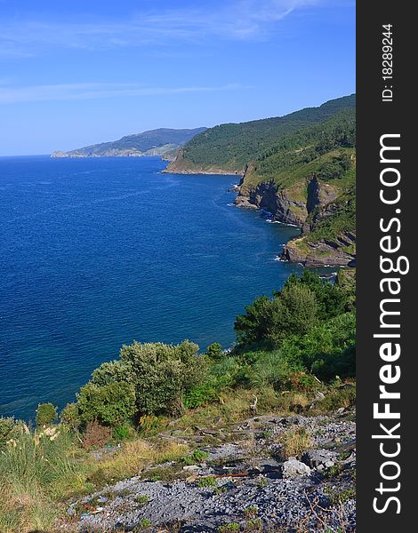 Beautiful view of the green basque coastline in a sunny day. Northern Spain. Beautiful view of the green basque coastline in a sunny day. Northern Spain.