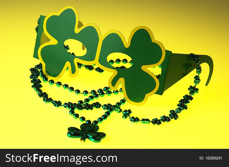 Close up of St. Patrick's day glasses and necklace