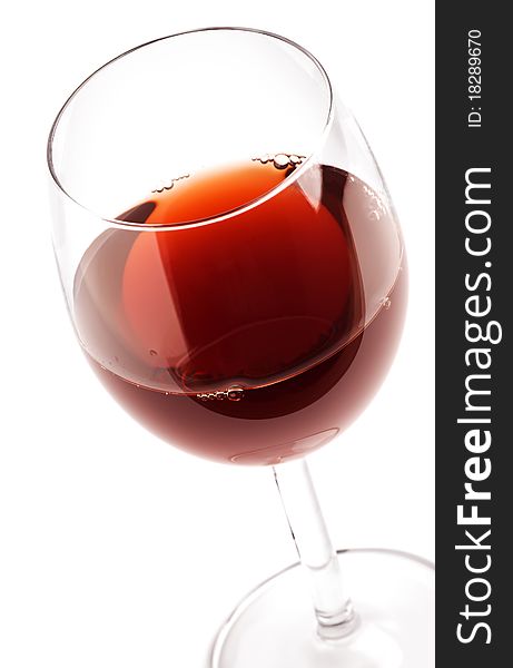 Glass with red wine on white. Glass with red wine on white