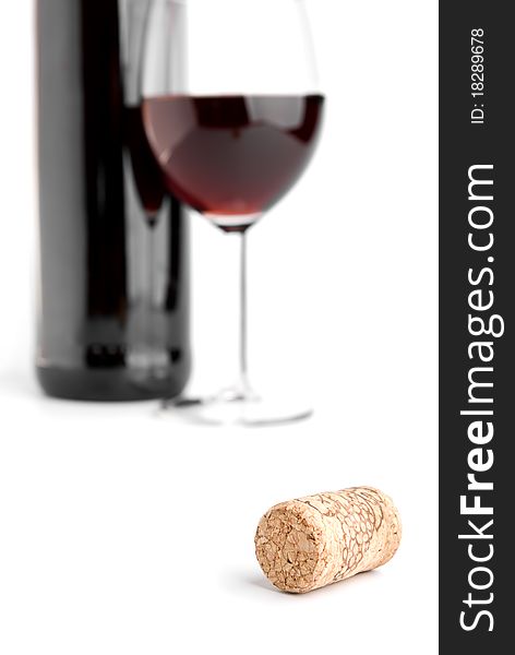 Wine cork and glass on white. Wine cork and glass on white