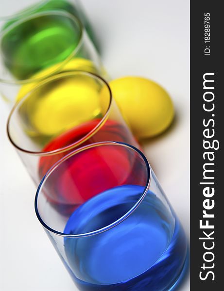 Blue, red, yellow and green dye with Easter egg. Blue, red, yellow and green dye with Easter egg