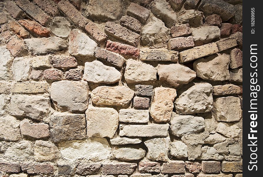 Brick and stone wall texture with messy structure. Brick and stone wall texture with messy structure