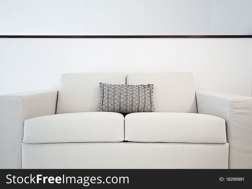 Detail of a double seat sofa with cushions. Detail of a double seat sofa with cushions