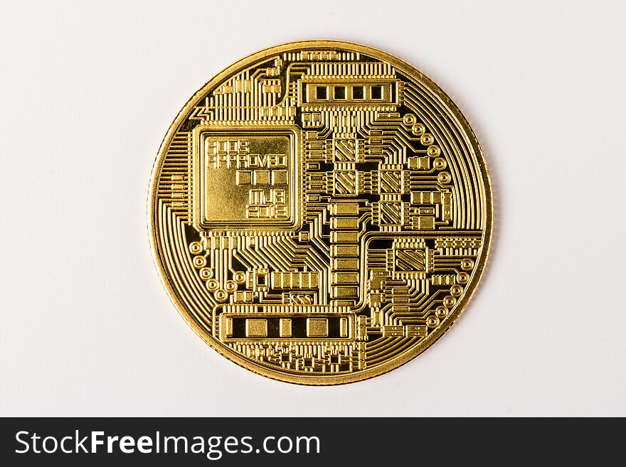 Gold bitcoin in close-up on white background. Business, money, cryptocurrency concept