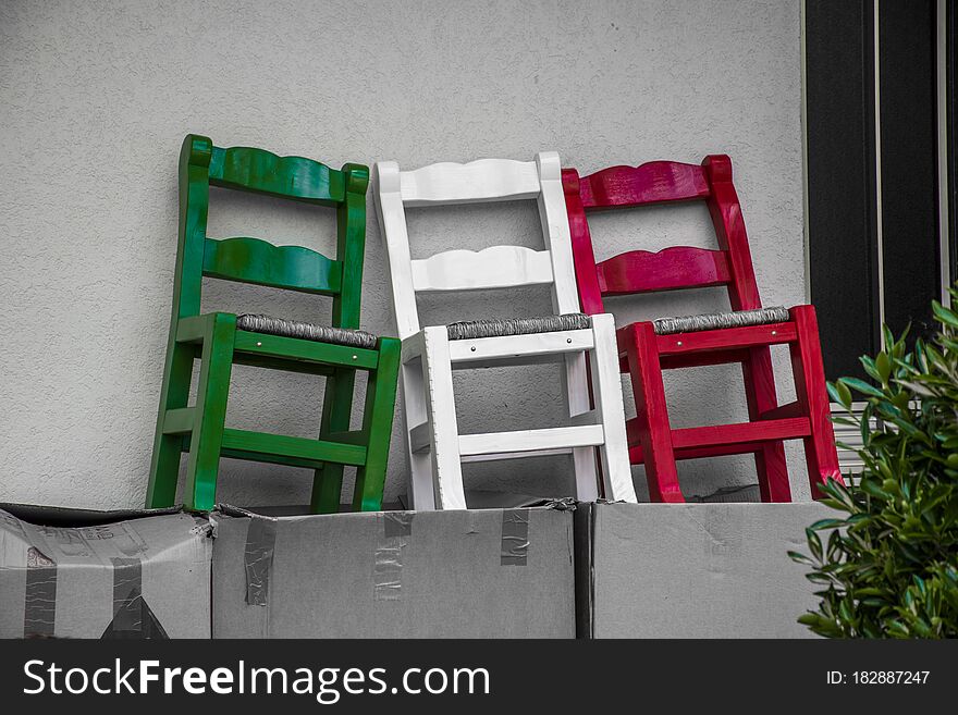 Green, white and red colored chairs form the Italian flag. Green, white and red colored chairs form the Italian flag