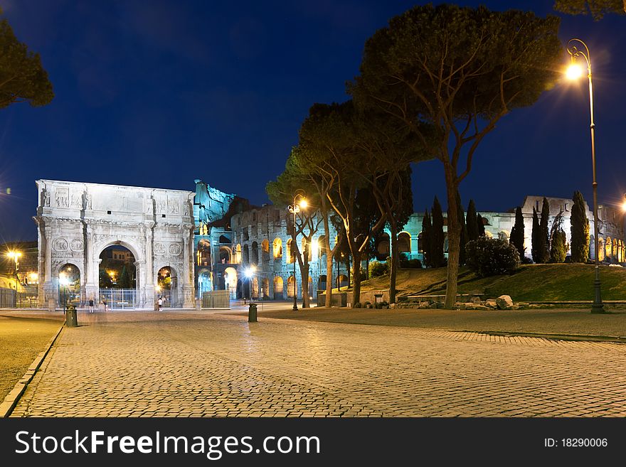 The Colosseum and the Arch of Constantine at night. The Colosseum and the Arch of Constantine at night