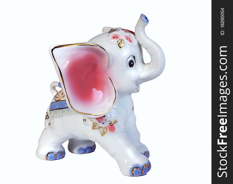 Porcelain figurine of elephant, large pink ears, trunk, raised, smile. Porcelain figurine of elephant, large pink ears, trunk, raised, smile