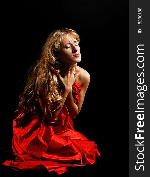 Blond woman in red - painfull emotions