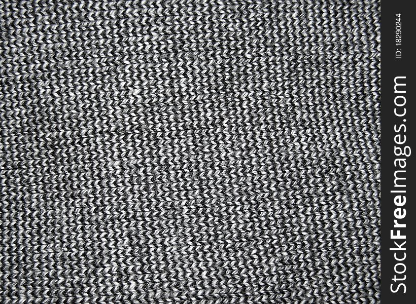Background made of a knitted dark clothing. Background made of a knitted dark clothing.