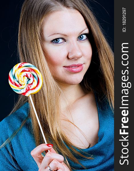 Beautiful Girl Holding A Candy