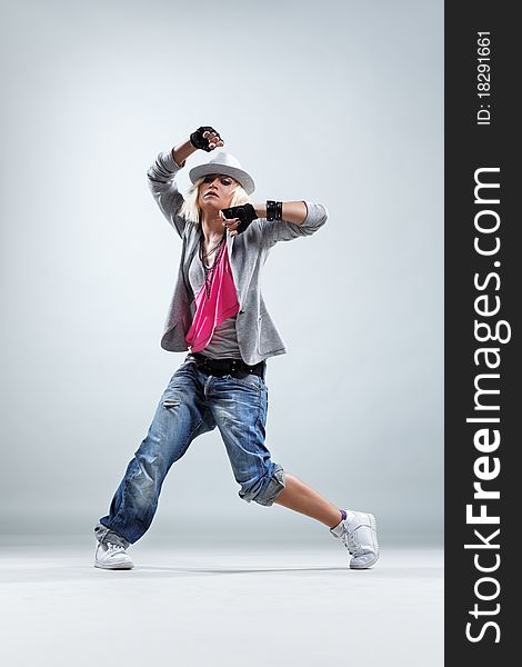 Modern style dancer posing on studio background. Modern style dancer posing on studio background