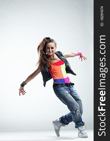 Modern style dancer posing on studio background. Modern style dancer posing on studio background