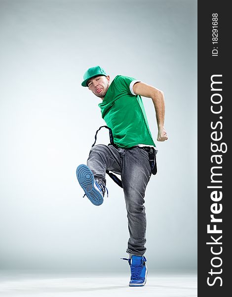 Modern style dancer posing on studio background. Modern style dancer posing on studio background