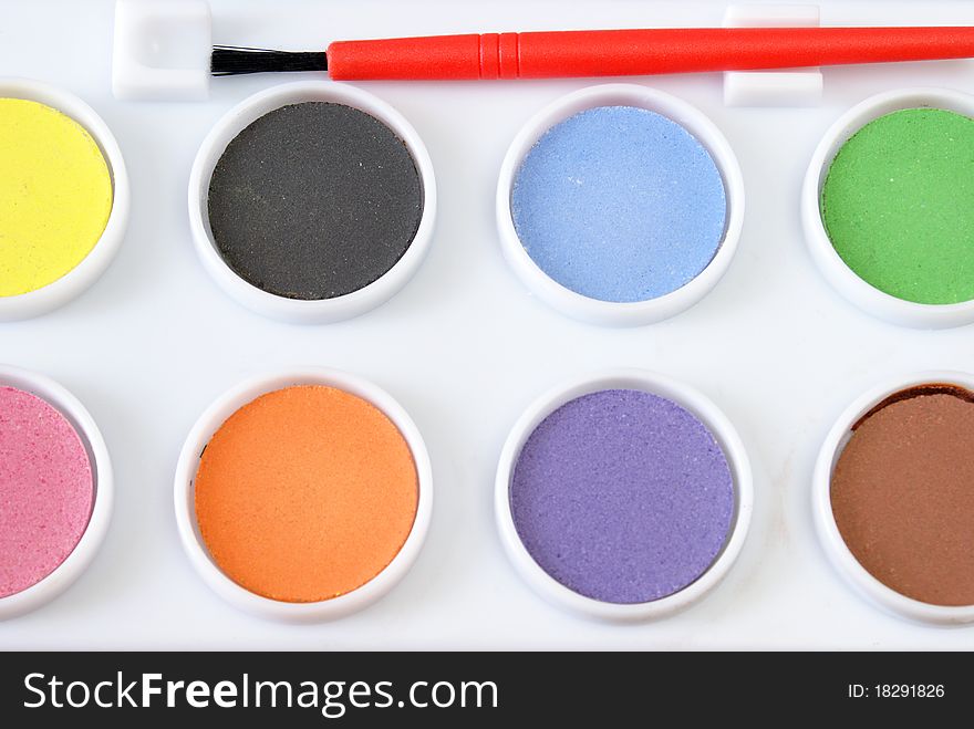 A childs watercolor paint set with various colors to choose from.