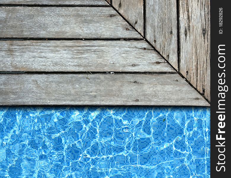 Wood pavement with pool background